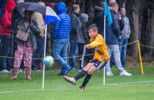 Samim takes the first cornere in monsoon conditions.